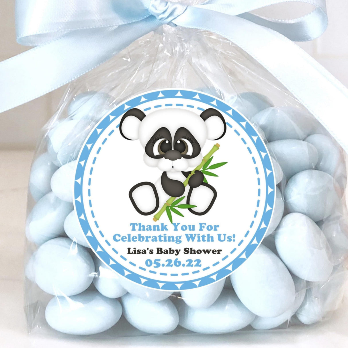 Blue panda baby shower sticker with outlined panda and bamboo