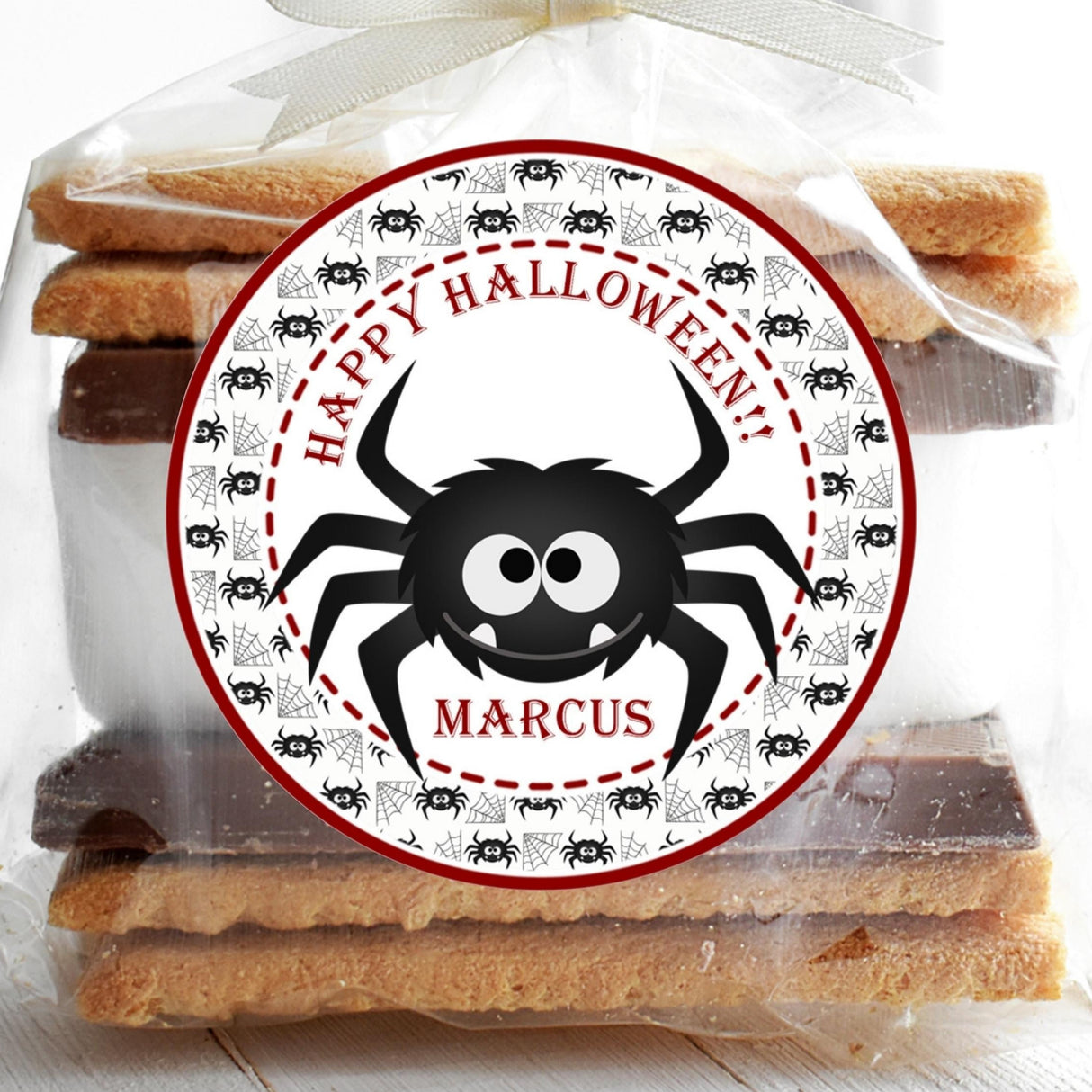 Halloween spider sticker with black spider and red web border for party favors