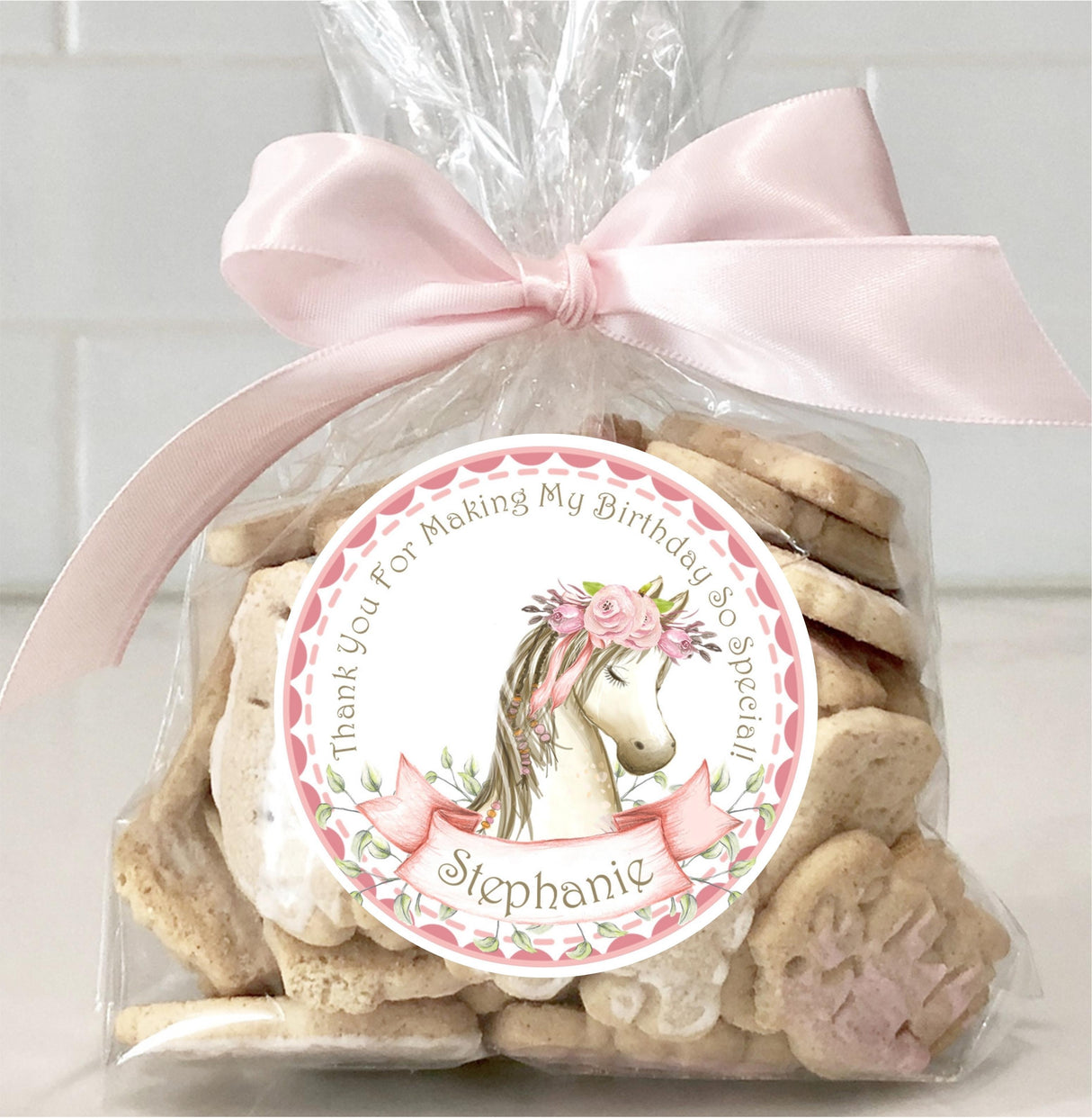 Horse-themed birthday favor label in pink and cream