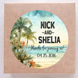Beach wedding sticker with palm trees and ocean background