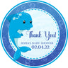 Blue dolphin baby shower sticker with ocean bubbles and wave background