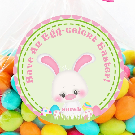 Easter bunny sticker sitting in grass with eggs