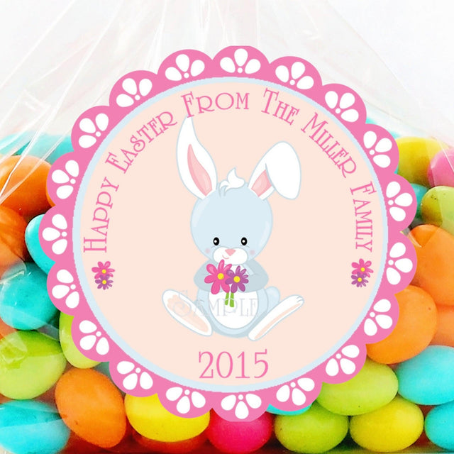 Pink Easter bunny sticker holding flowers with scalloped border