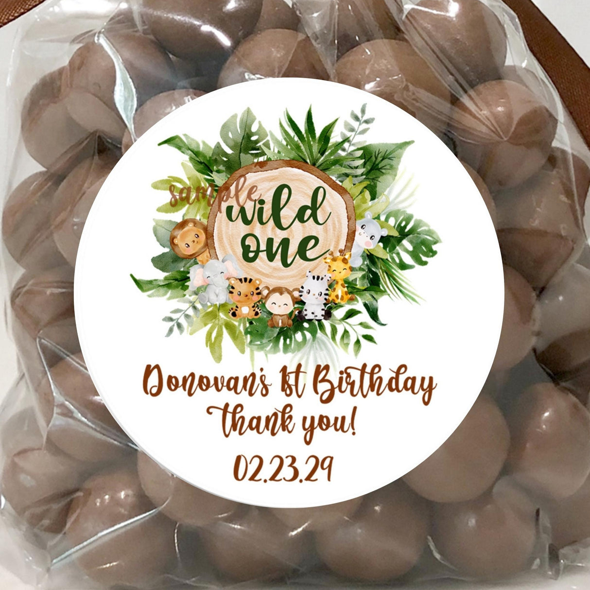 Wild one safari animals first birthday sticker design with tropical leaves