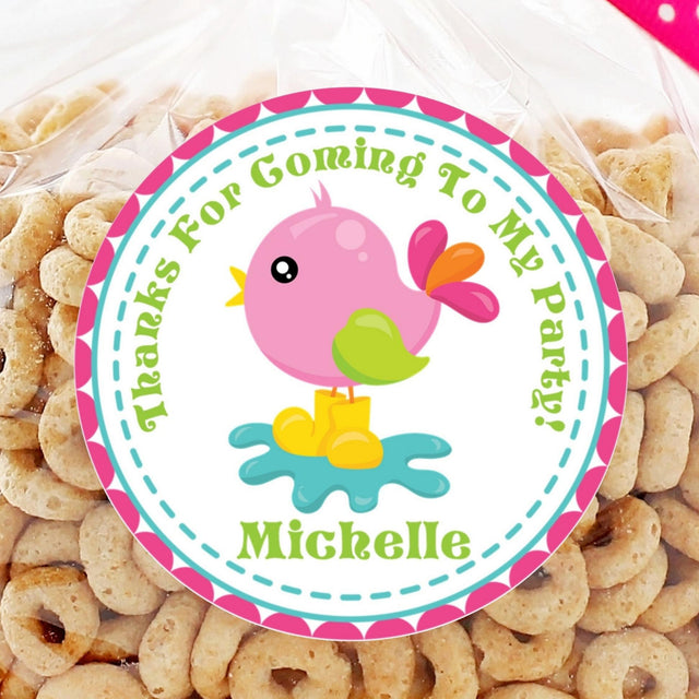pink bird birthday sticker with teal and yellow accents