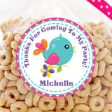 teal bird birthday sticker with pink and orange wings