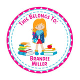 Back to school round name label featuring girl character and book pile