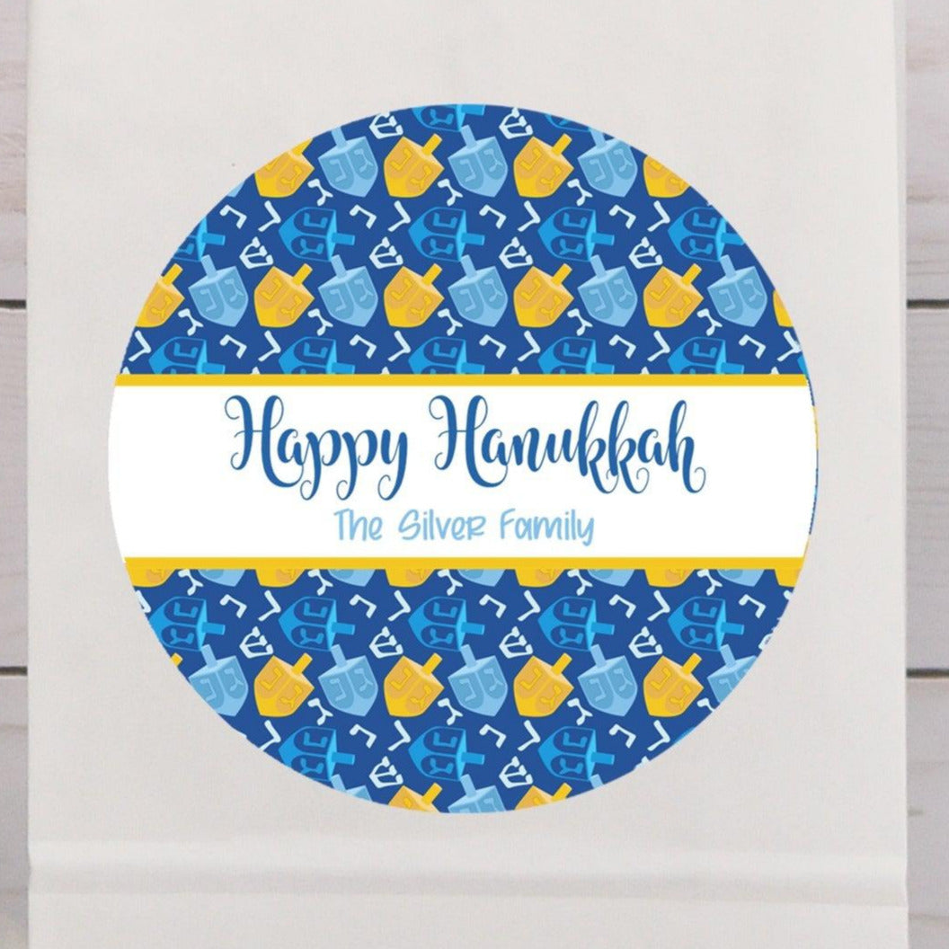 Happy Hanukkah dreidel stickers with blue and yellow dreidel pattern