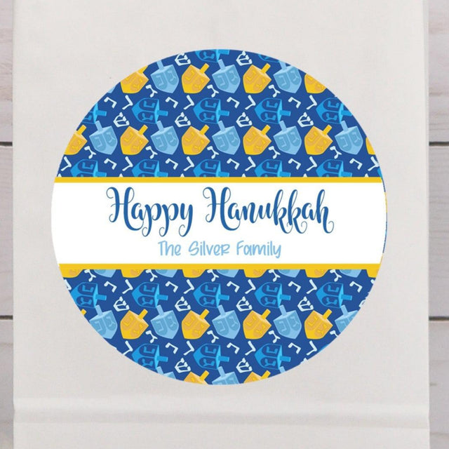 Happy Hanukkah dreidel stickers with blue and yellow dreidel pattern
